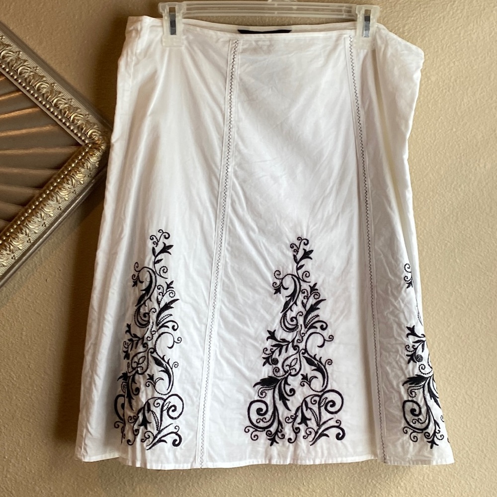 White skirt with black Embroidered flowers front and back